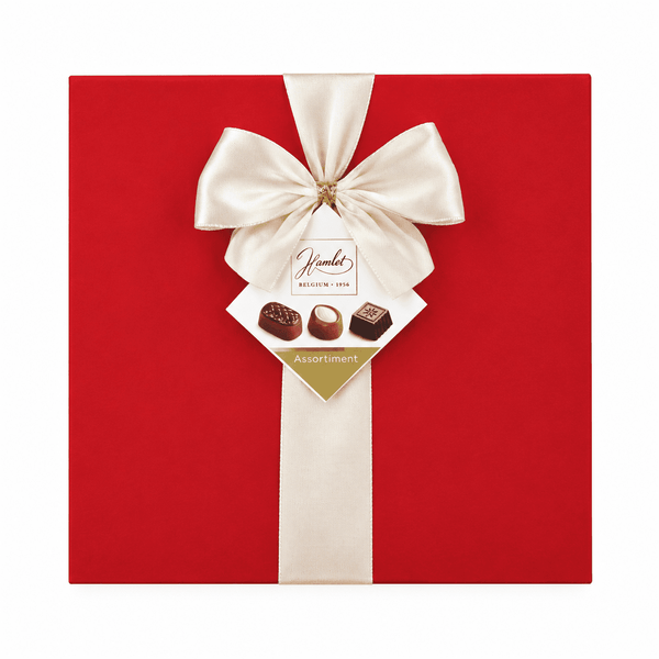 Deep red velvet chocolate box with cream satin ribbon and Hamlet logo tag