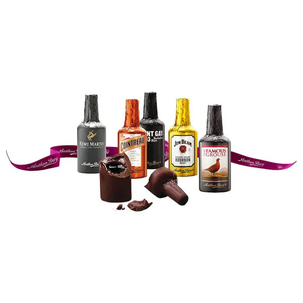 Anthon Berg chocolate liqueur bottles shaped like liquor brands with broken milk chocolate revealing dark centers