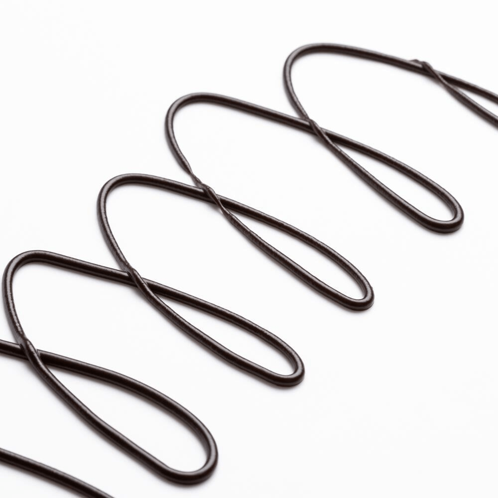 Glossy dark chocolate sauce zigzag drizzle texture