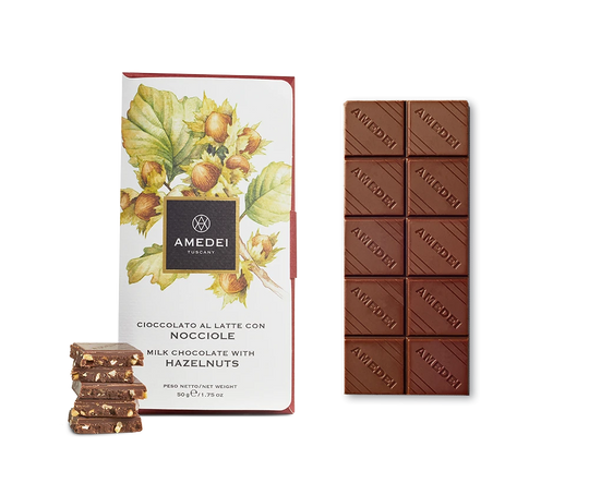 Chokladshopen Amedei Toscano Nocciola mjölkchokladkaka med hela rostade hasselnötter och vacker botanisk förpackning.