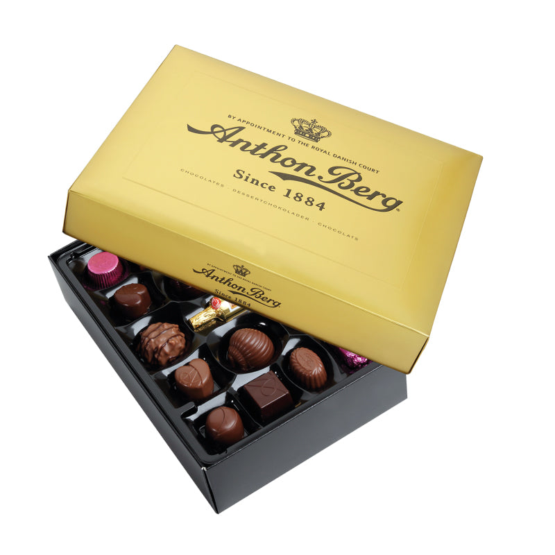 Chokladshopen Anthon Berg Guldask med lyxiga chokladpraliner i en elegant guldfärgad presentförpackning