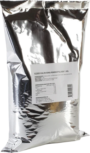 Chokladshopen Valrhona kakaopulver i en 1 kg silverfärgad förpackning med produktinformation och näringsdeklaration.